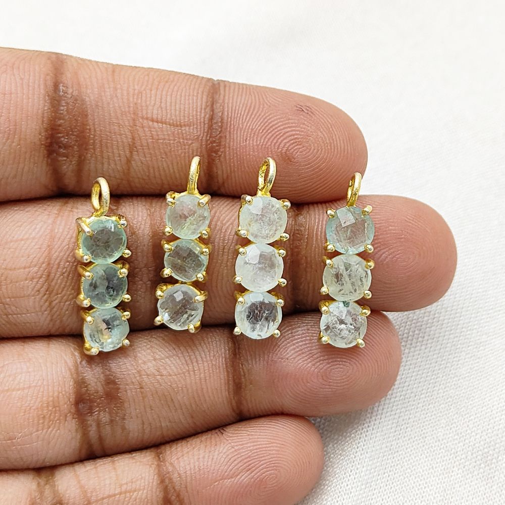 Elegant gold plated pendant with aquamarine gemstones