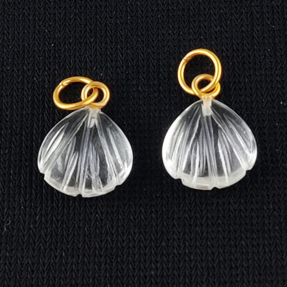 Elegant 12mm heart-shaped gold-plated silver pendant necklace featuring a crystal clear carved gemstone.