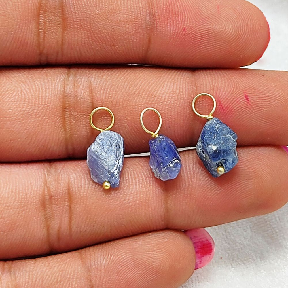 Handmade raw blue tanzanite pendant wrapped in gold-plated silver – a perfect December birthstone charm