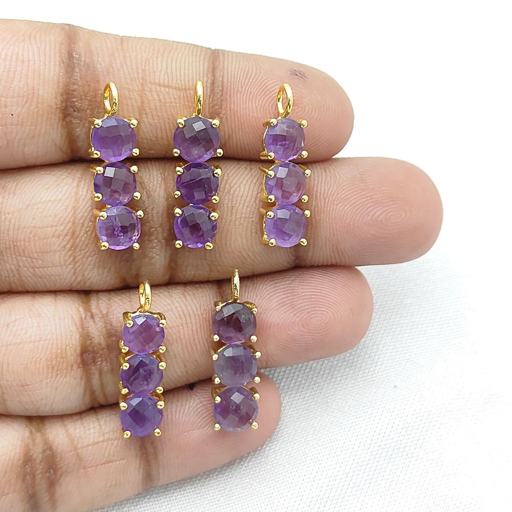 Elegant gold pendant with purple amethyst gemstones