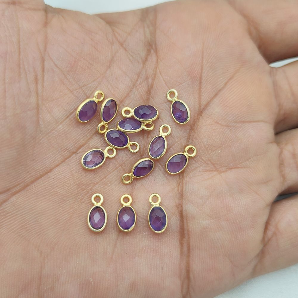 Dainty February birthstone pendant featuring an amethyst gemstone