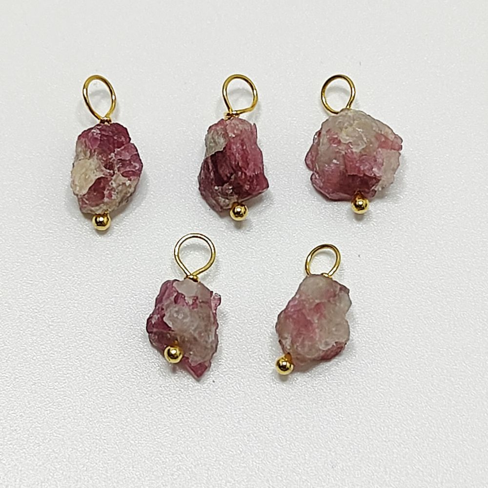 Handmade pink tourmaline pendant wrapped in gold-plated sterling silver – a delicate charm for dainty jewelry