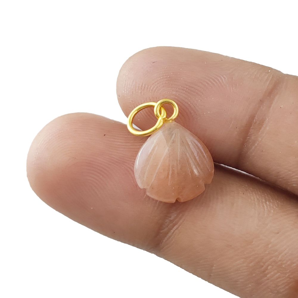 Handmade dainty jewelry featuring a peach moonstone heart pendant in a gold-plated silver seashell setting