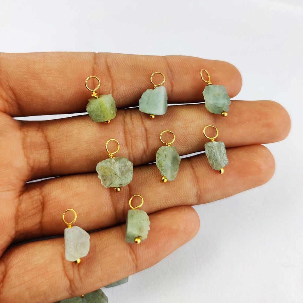 Natural aquamarine pendant with gold-plated wire wrapping – a stunning addition to your jewelry creations