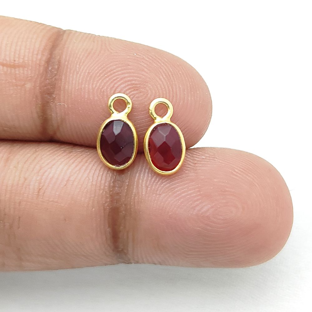 Gold-plated garnet necklace featuring deep red oval stone