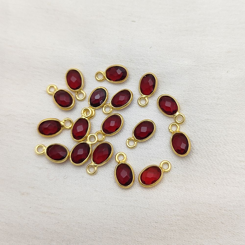Minimalist oval garnet gemstone charm in gold setting