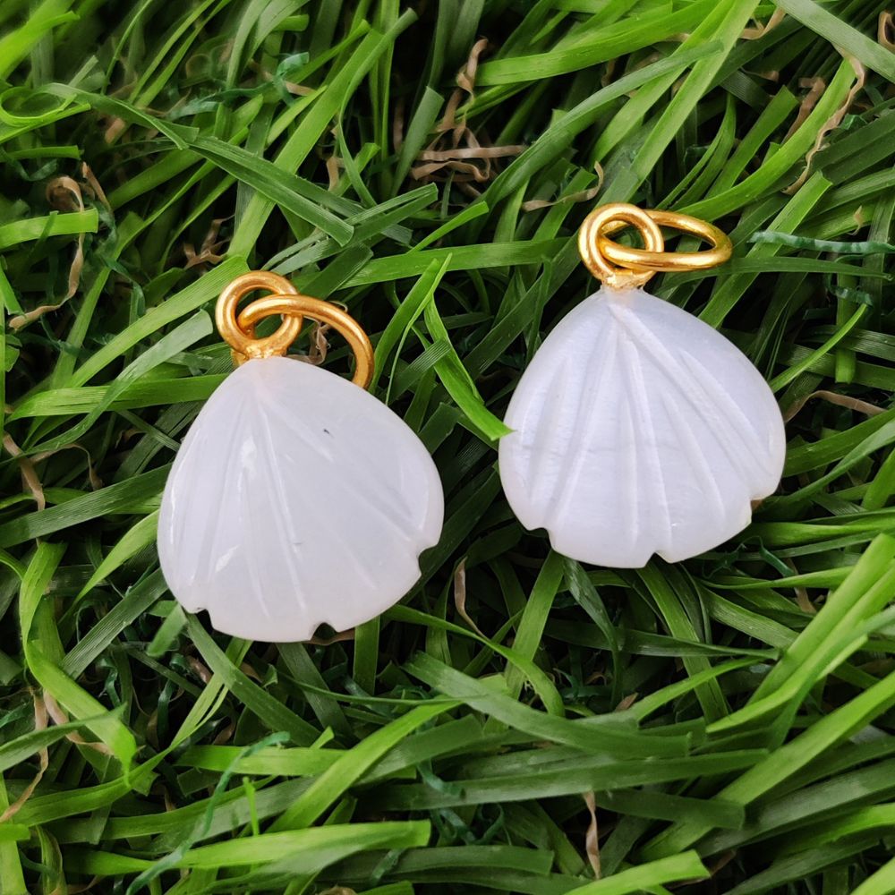 Unique seashell carved heart-shaped pendant featuring white moonstone, crafted in gold-plated sterling silver.