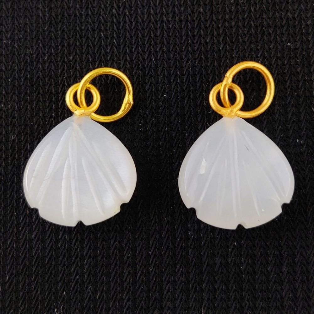 Exquisite handmade jewelry featuring a seashell carved pendant with white moonstone in a gold-plated sterling silver setting.