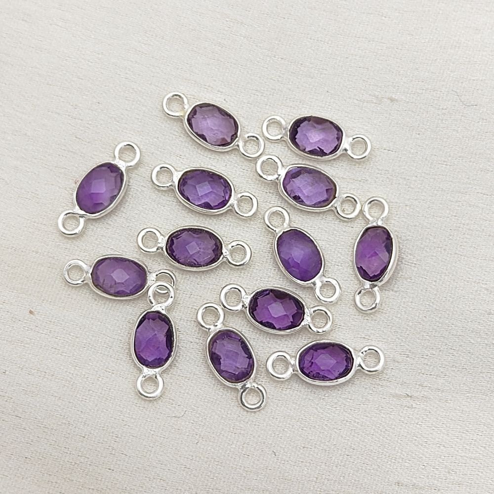 4x6mm amethyst connector in gold bezel setting