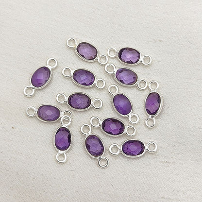 4x6mm amethyst connector in gold bezel setting