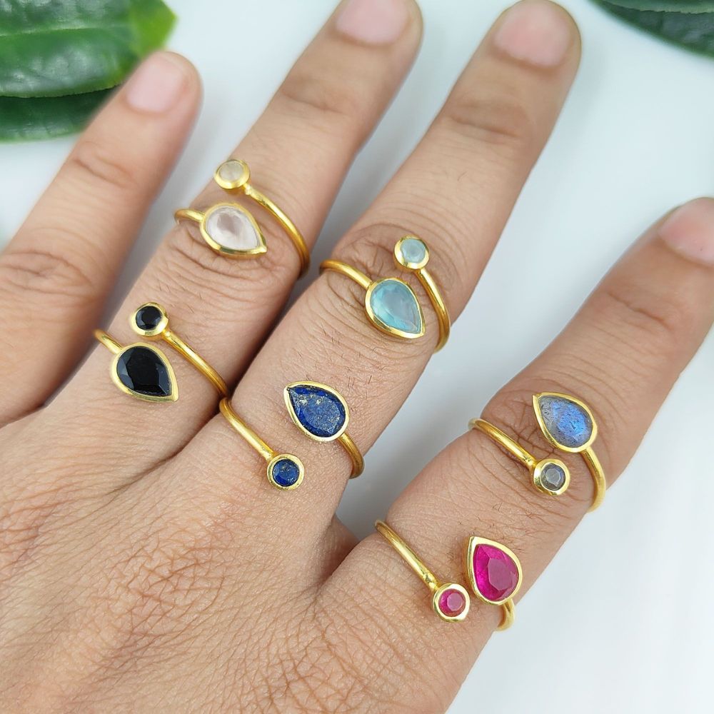 Adjustable open band ring with two soft pink rose quartz gemstones, gold plated sterling silver