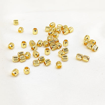 Tiny gold tube beads for jewelry making and crafting