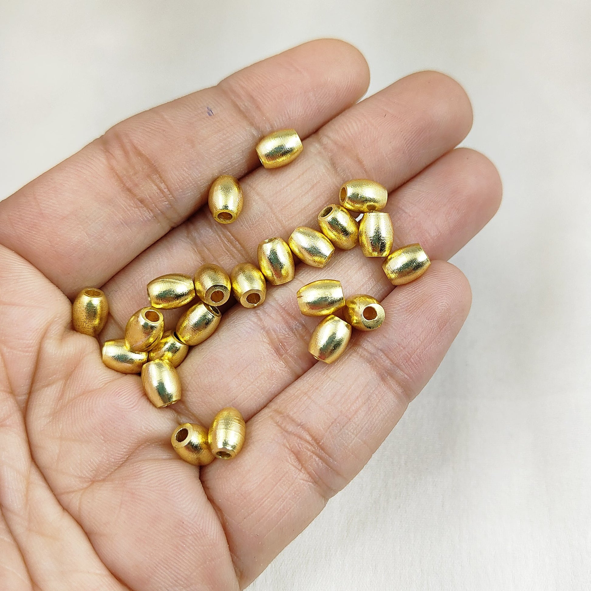 Handmade jewelry components: gold plated oval spacer beads
