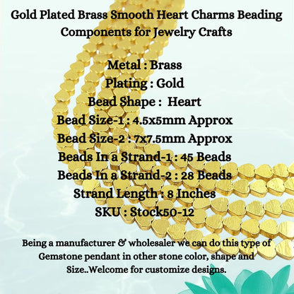 Close-up of smooth heart shaped gold plated brass charms