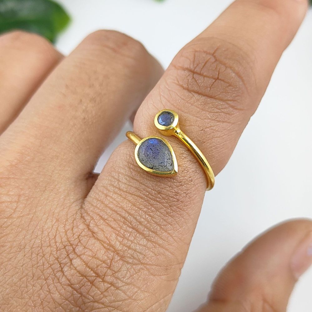 Handcrafted sterling silver ring with gold plating featuring two faceted blue labradorite stones and adjustable band