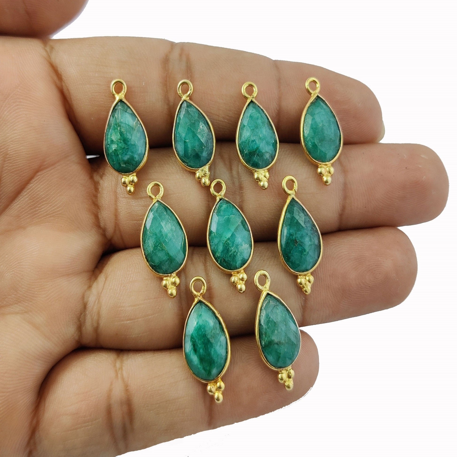 Vintage gold-plated pendant featuring a dyed green emerald in a pear shape, perfect for jewelry making