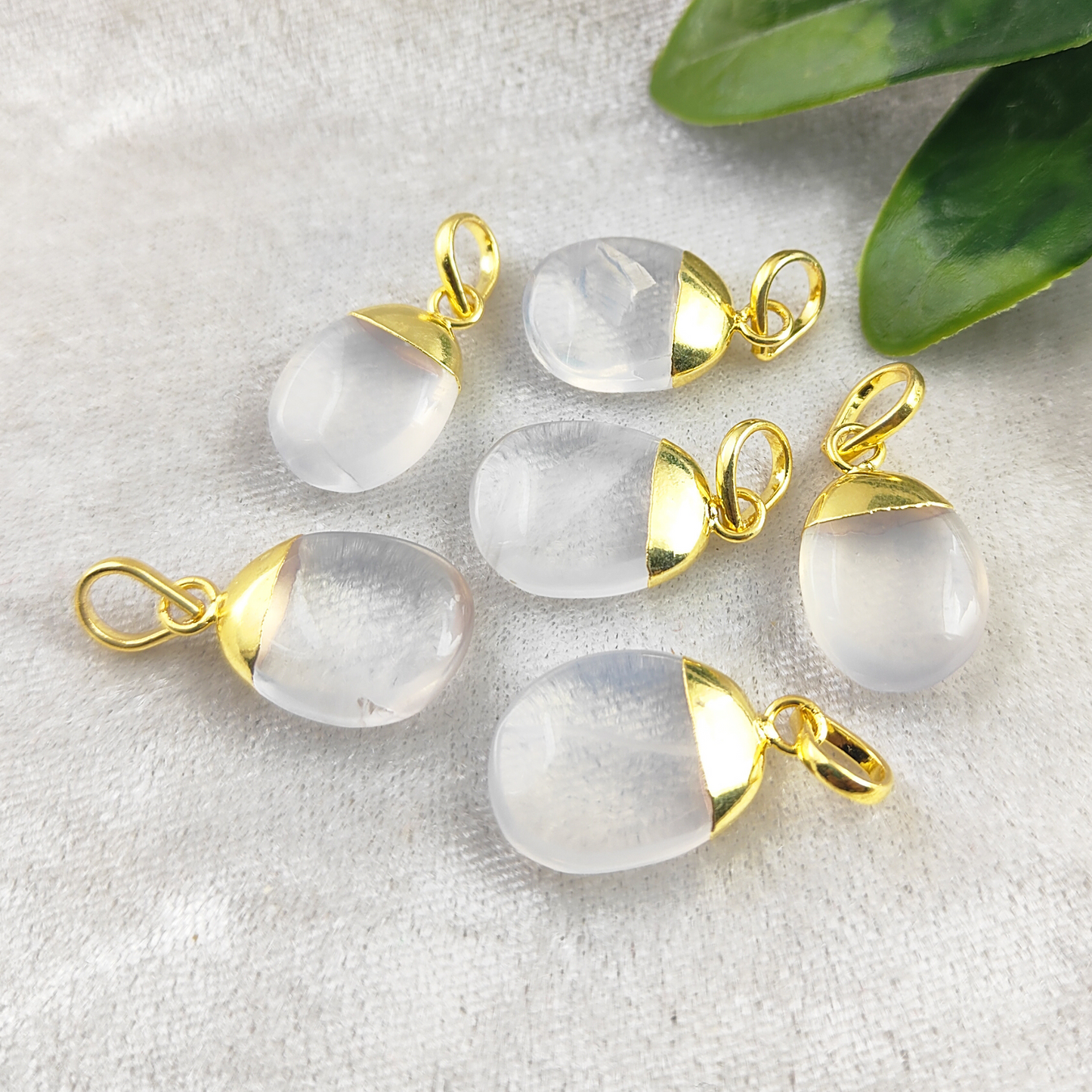 Each pendant is handcrafted with stunning ice quartz gemstones, ensuring a one-of-a-kind piece that reflects natural beauty