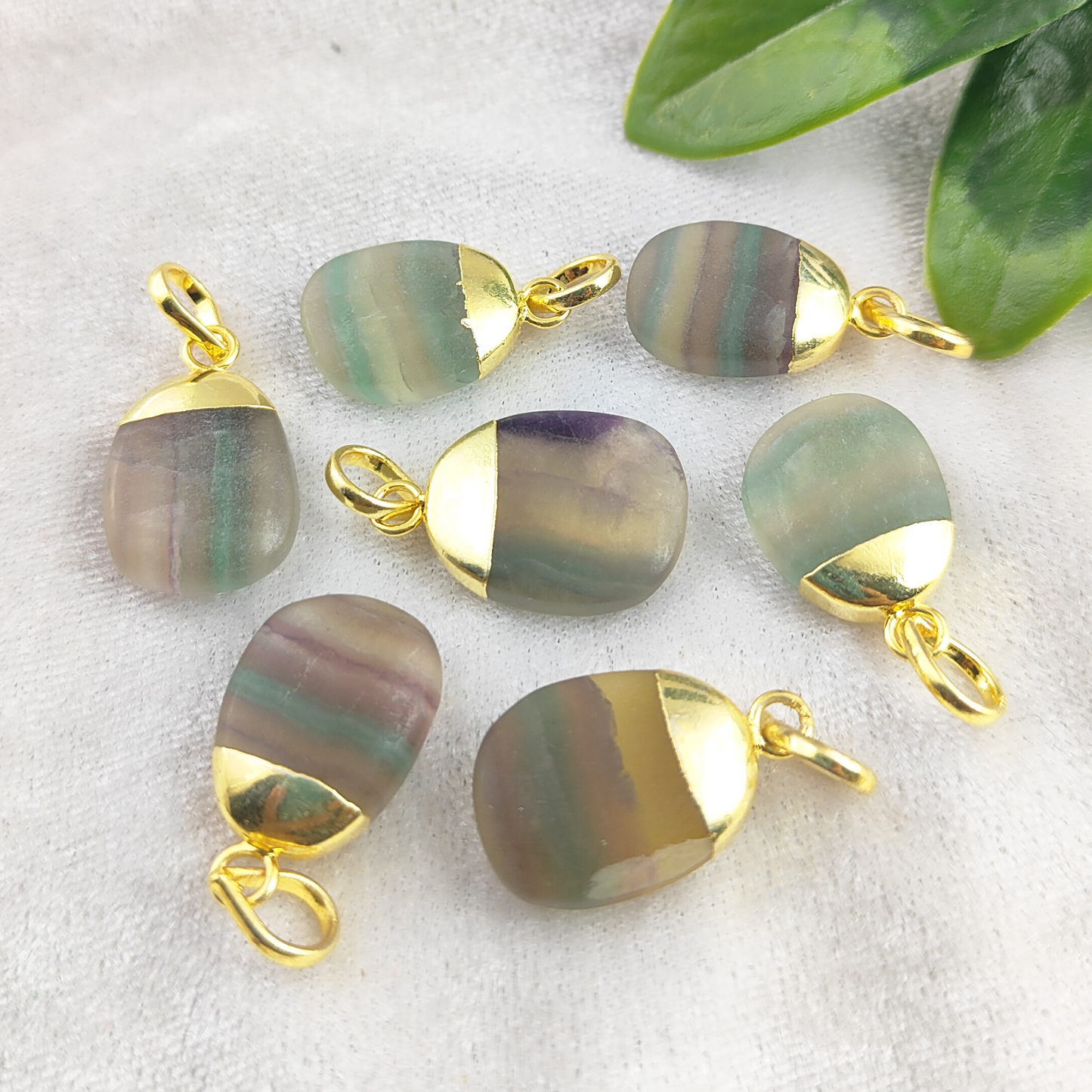 Each pendant features vibrant multi-fluorite gemstones, handcrafted with care for a unique, one-of-a-kind piece