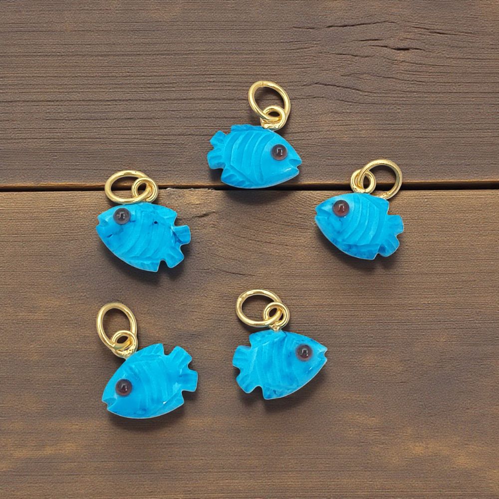 Close-Up of Hand-Carved Turquoise Fish Pendant with Gold Plated Bail