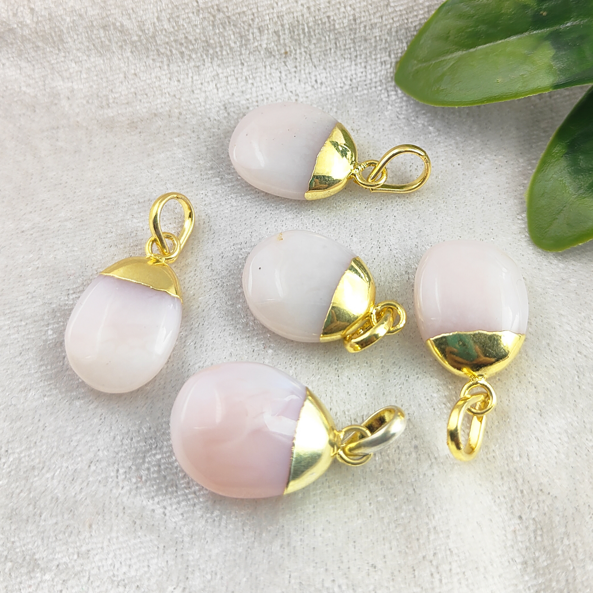 Embrace the beauty of minimalism with our Pink Opal Pendant, delicately gold electroplated for a touch of luxury