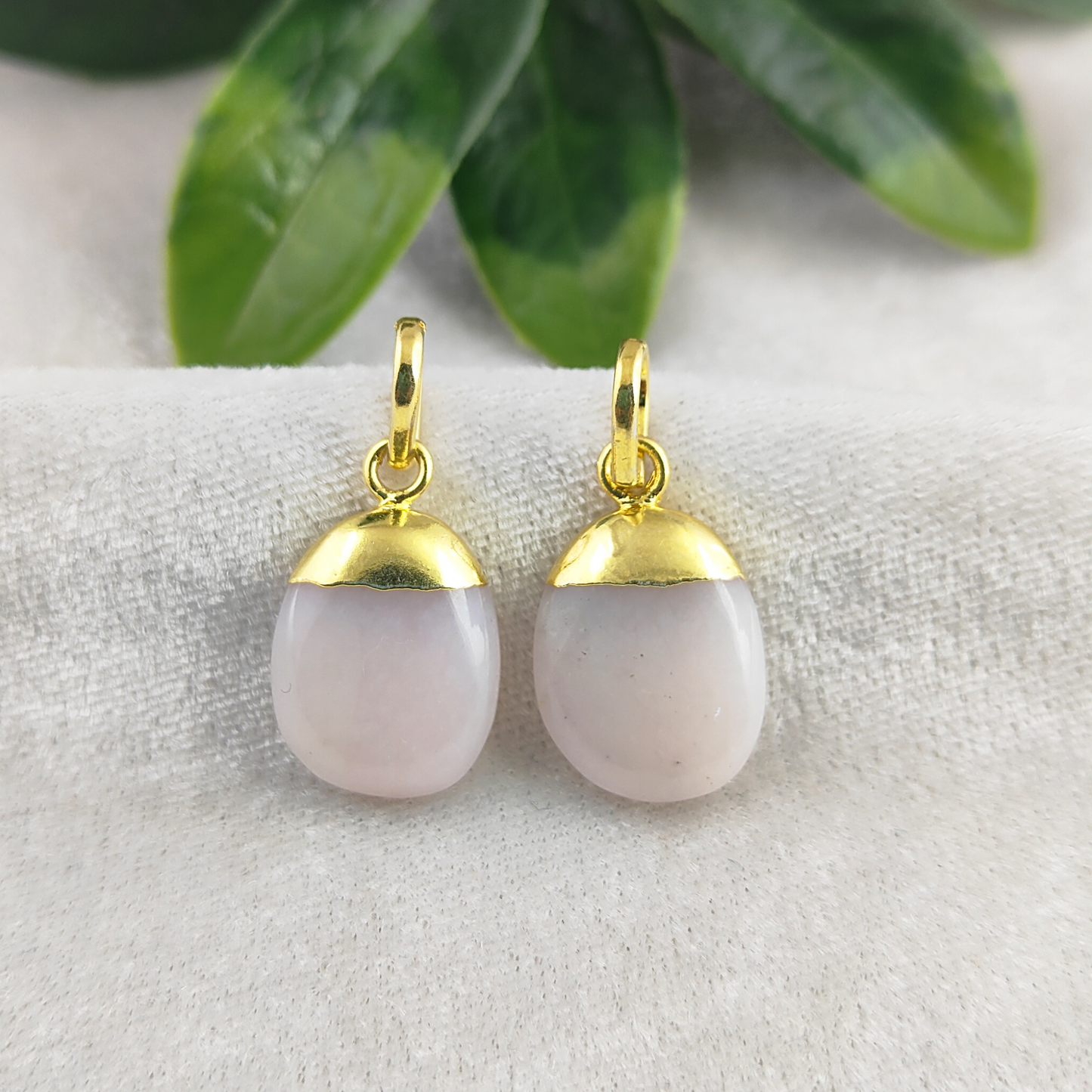 Each piece is handmade, showcasing the unique charm of natural pink opal