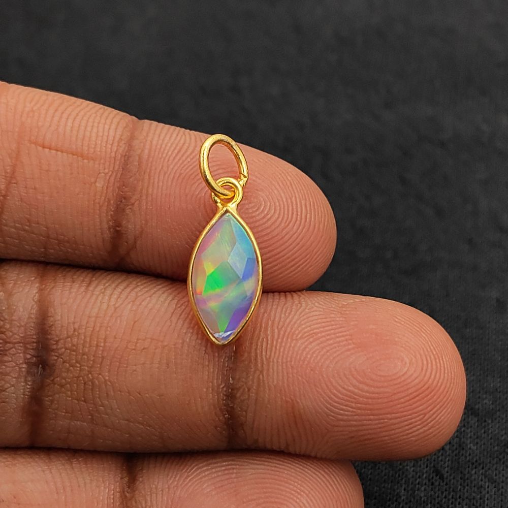 Faceted marquise synthetic opal charm with rainbow fire colors for jewelry designers